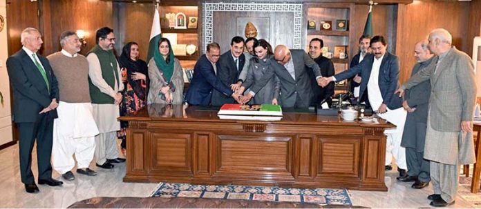 Chairman Senate Syed Yousaf Raza Gilani, along with senators, cuts a cake to mark the 58th Youm-e-Tasees of the Pakistan People’s Party (PPP) at Parliament House