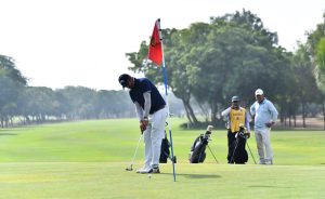 A golfer takes a shot during the 29th CNS Open Golf Championship 2024 at Karachi Golf Club.