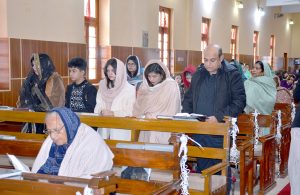 Christian Community members performing religious rituals on Christmas Day at Methodist Church.