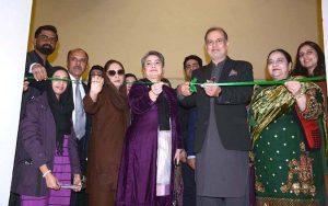 Commissioner Faisalabad Division Raja Jahangir Anwar and Prof. Dr. Kanwal Ameen (T.I.), Vice Chancellor of GCWUF, cutting ribbon to inaugurate a painting exhibition organized by Government College Women University Faisalabad at Punjab Art Council.