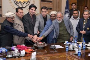 Senior Vice President Muhammad Murad Arshad, Vice President Sheikh Suleman Sheikh, and Christian Scouts cut the Christmas cake during the ceremony.