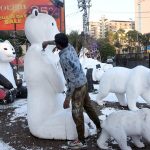 A worker paints a statue of Panda by the PHA near the Liberty Roundabout.