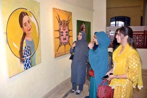 Commissioner Faisalabad Division Raja Jahangir Anwar and Prof. Dr. Kanwal Ameen (T.I.), Vice Chancellor of GCWUF, cutting ribbon to inaugurate a painting exhibition organized by Government College Women University Faisalabad at Punjab Art Council.