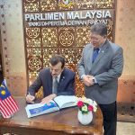 Chairman Senate of Pakistan, Syed Yousaf Raza Gilani recording his comments on visitor’s book placed at Parliament of Malaysia