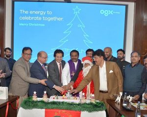 Federal Minister Ali Pervaiz Malik cutting the Christmas cake during the Christmas Celebrations organized at OGDC.