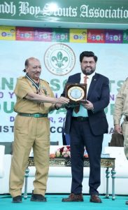 Provincial Commissioner Justice (Retd) Hassan Feroze presenting a shield to Governor Sindh and Chief Patron Kamran Khan Tessori on behalf of the institution.