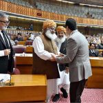 Chairman Senate, Syed Yousaf Raza Gilani shaking hands with Pervez Ashraf, Former Prime Minister during Joint Session of Parliament at Parliament House