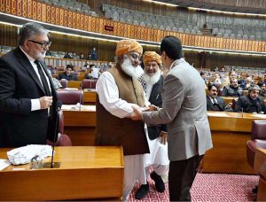 Chairman Senate, Syed Yousaf Raza Gilani shaking hands with Pervez Ashraf, Former Prime Minister during Joint Session of Parliament at Parliament House