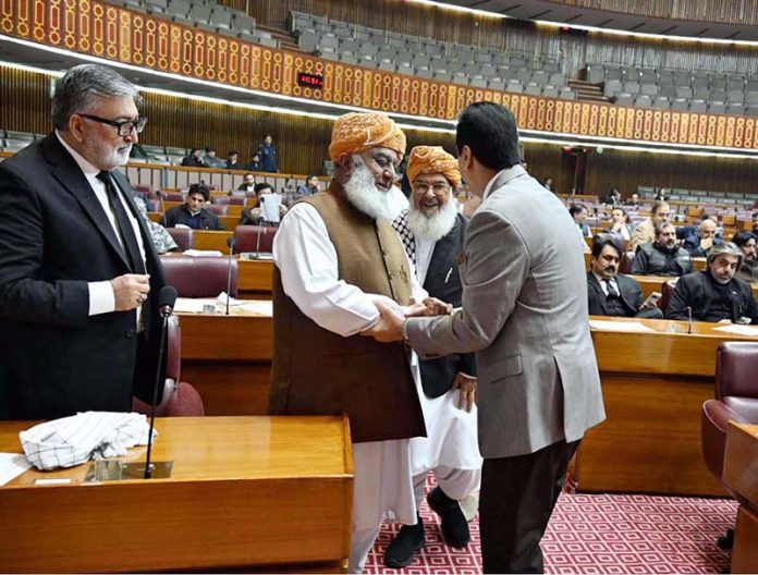Chairman Senate, Syed Yousaf Raza Gilani shaking hands with Pervez Ashraf, Former Prime Minister during Joint Session of Parliament at Parliament House