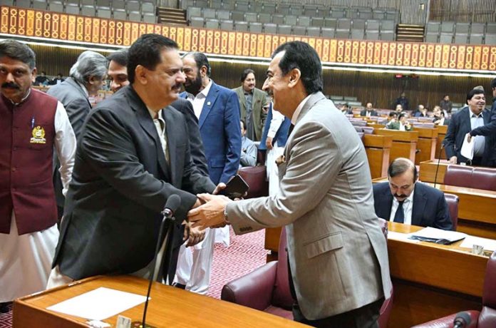 Chairman Senate, Syed Yousaf Raza Gilani shaking hands with Sardar Nabil Ahmed Gabol during Joint Session of Parliament at Parliament House
