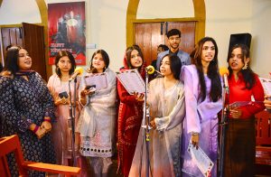 Christian community members performing religious rituals on Christmas Day at St. Thomas Church.