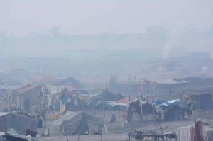 A blanket of thick morning fog engulfs the outskirts of the city, significantly reducing visibility during the early hours.