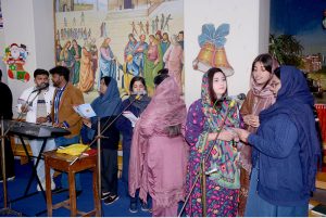 Christian community members performing religious rituals on Christmas Day at Catholic Church Railway Road.