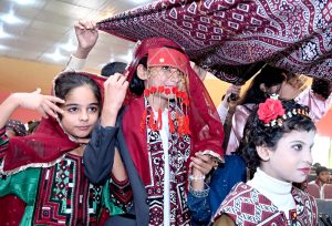 Students of Mehran Science School performing in a tableau during a Sindhi Culture function at Sir Shahnawaz Bhutto Memorial Library.