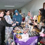 Women visiting a handicraft exhibition at the ceremony on the theme of Empowered Women for a Prosperous Pakistan at the State Bank of Pakistan Building