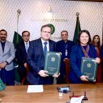 Secretary Economic Affairs Division, Muhammad Humair Karim, and Country Director of the Asian Development Bank, Emma Fan, display the signed documents between Pakistan and ADB.