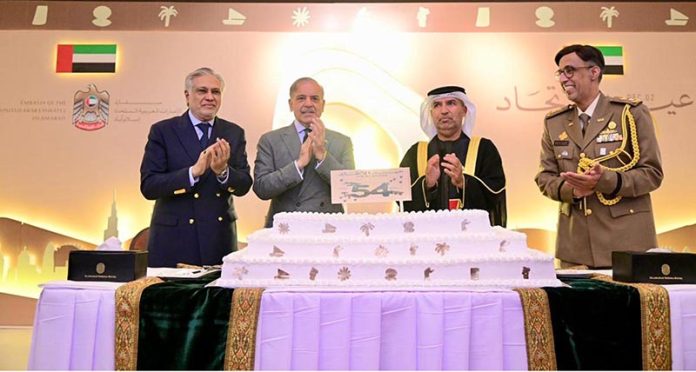 Prime Minister Muhammad Shehbaz Sharif cuts cake at a ceremony of the national day of the United Arab Emirates