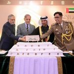 Prime Minister Muhammad Shehbaz Sharif cuts cake at a ceremony of the national day of the United Arab Emirates