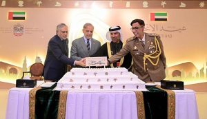 Prime Minister Muhammad Shehbaz Sharif cuts cake at a ceremony of the national day of the United Arab Emirates