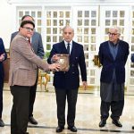 Prime Minister Muhammad Shehbaz Sharif presents shields to the members of government team which led the privatisation of PIA.