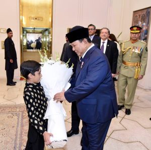 A bouquet being presented to Indonesian President, Prabowo Subianto Djojohadikusumo upon his arrival at Aiwan-e-Sadr.