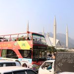 People enjoy a ride on the double-decker bus at Faisal Masjid, part of a service aimed at promoting tourism in the Federal Capital