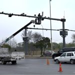 A worker is busy repairing CCTV cameras during maintenance work along Srinagar Highway in the Federal Capital