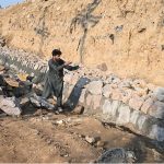 Labourers are busy with construction work near 10th Avenue as part of development activities in the Federal Capital