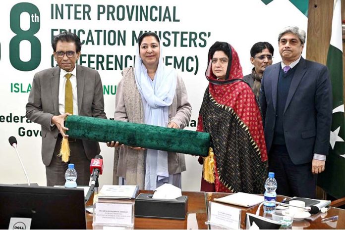 Federal Minister for Federal Education and Professional Training, Dr. Khalid Maqbool Siddiqui presenting souvenir to the participants during 38th Inter Provincial Education Ministers' Conference (IPEMC) at AIOU