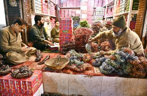 Women are busy selecting and purchasing bangles from vendor at Bangles Market. The bangles are supplied from Hyderabad to shops across the country.