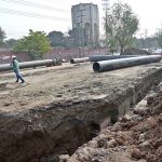 Workers are busy laying pipes for underground wires on Saidpur Road