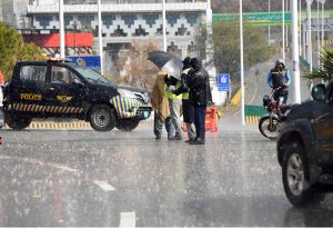 Traffic police stop vehicles heading towards Murree on the Murree Expressway and GT Road due to heavy snowfall, to ensure public safety.