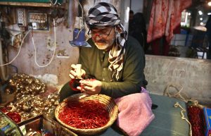 Women are busy selecting and purchasing bangles from vendor at Bangles Market. The bangles are supplied from Hyderabad to shops across the country.