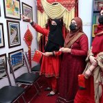 Female visitors taking interest in display china pictures during the celebration of Pak China Friendship 75th Anniversary at China Window