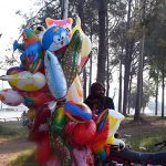A vendor displaying balloons to attract customers in the Federal Capital.
