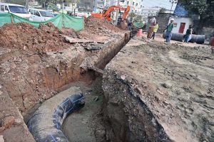 Workers are busy laying pipes for underground wires on Saidpur Road