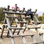 Children enjoying swings at a local park near F-6 sector