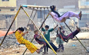 Girls are enjoying the swing at old subzi mandi area.