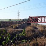 A beautiful view of a train passing over a bridge near Margalla Railway Station in the I-10 sector of the Federal Capital