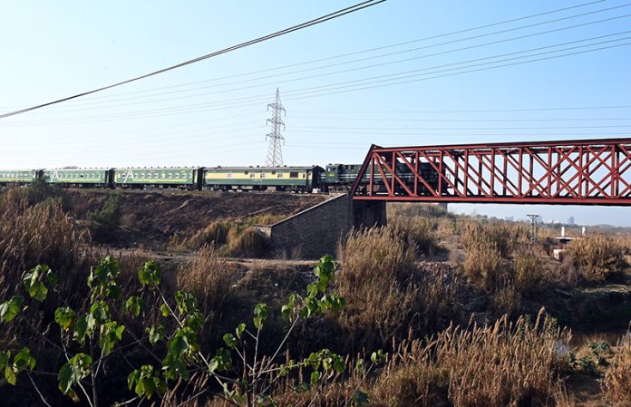 A beautiful view of a train passing over a bridge near Margalla Railway Station in the I-10 sector of the Federal Capital