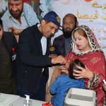 Deputy Commissioner Muhammad Noman Sadiq administers polio drops to a child during the inauguration of the three-day anti-polio campaign at Shahbaz Sharif Hospital