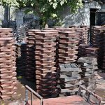A labourer is busy preparing tuff tiles in a local factory in the Federal Capital