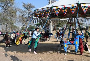 Children enjoy jumping on trampoline at a local park in the Federal Capital