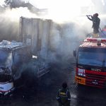 Firefighters battle to control a blaze at a CNG filling station along the bypass