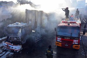 Firefighters battle to control a blaze at a CNG filling station along the bypass