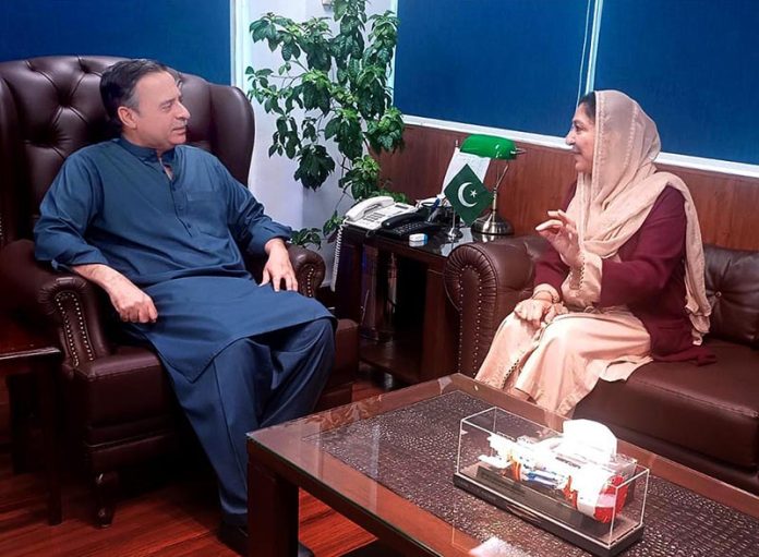 Federal Minister for Maritime Affairs Muhammad Junaid Anwar Chaudhry talking to Minister of State for Education and Professional Training, Wajiha Qamar