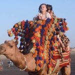 Children enjoy a camel ride at Seaview beach