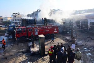 Firefighters battle to control a blaze at a CNG filling station along the bypass