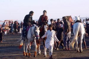 Children enjoy a camel ride at Seaview beach
