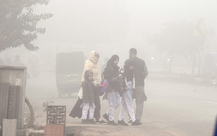 A dense blanket of fog envelops the entire Federal Capital during the early morning hours as children head to school amid low temperatures